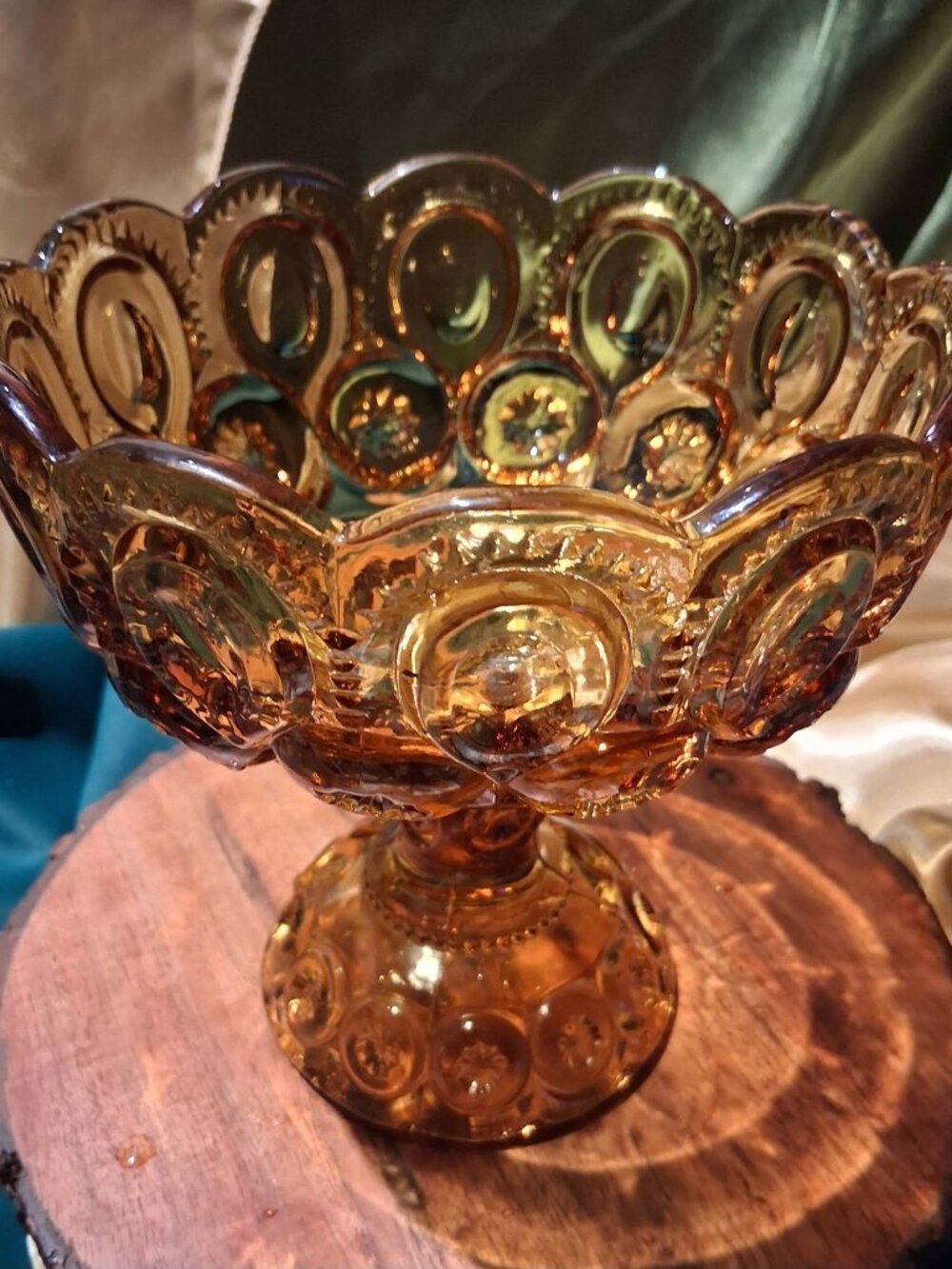 Vintage amber pressed glass footed compote in the classic "Moon and Star" patter